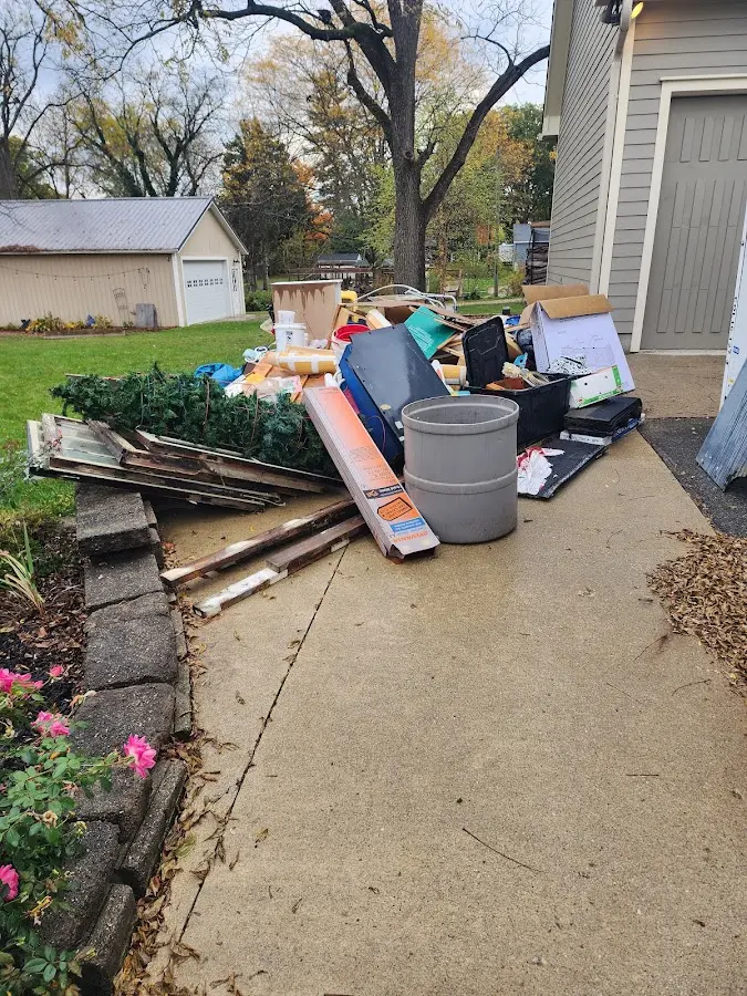 Dumpster being loaded with debris for Demolition Dumpster Rental in Merrillville